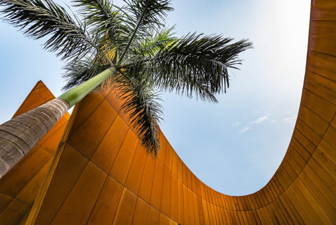 The Crescent by Sanjay Puri Architects, solar savvy architecture, curvaceous Corten Steel building, Corten Steel architecture, Corten steel office building, office design in India,