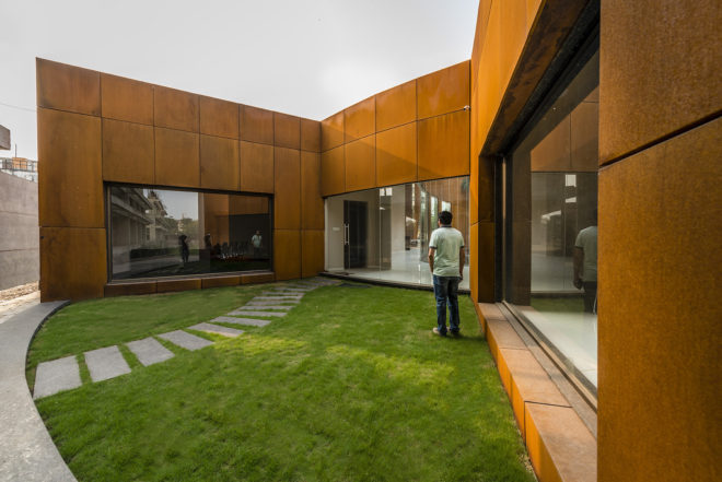 The Crescent by Sanjay Puri Architects, solar savvy architecture, curvaceous Corten Steel building, Corten Steel architecture, Corten steel office building, office design in India,