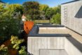 Measured Architecture, 90% recycled, Cloister House, Vancouver, playful elements, Japanese stone mason, Tamatsu Tongu, artist Fei Disbrow, weathering steel ladder, recycled bungalow