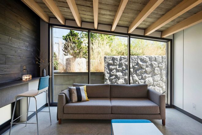 Measured Architecture, 90% recycled, Cloister House, Vancouver, playful elements, Japanese stone mason, Tamatsu Tongu, artist Fei Disbrow, weathering steel ladder, recycled bungalow
