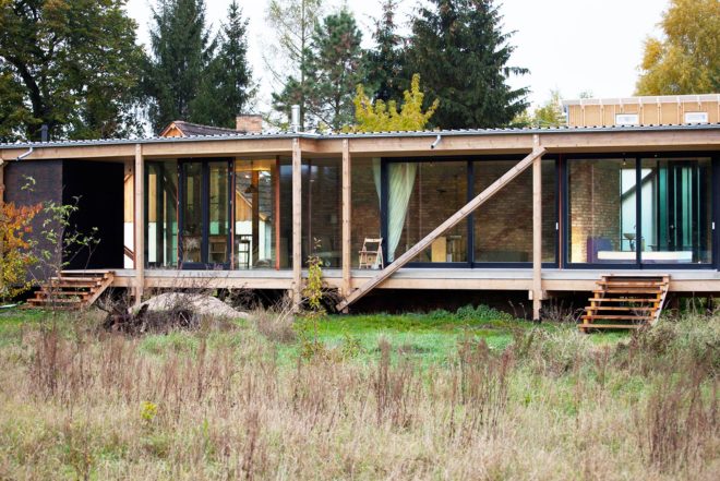 Peter Grundmann, prefab home, low cost home, House Neiling II, raised home, glass and wood minimal home, Berlin, single woman owner, DIY furniture, Löwenberger Land