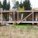 Peter Grundmann, prefab home, low cost home, House Neiling II, raised home, glass and wood minimal home, Berlin, single woman owner, DIY furniture, Löwenberger Land