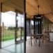 Peter Grundmann, prefab home, low cost home, House Neiling II, raised home, glass and wood minimal home, Berlin, single woman owner, DIY furniture, Löwenberger Land