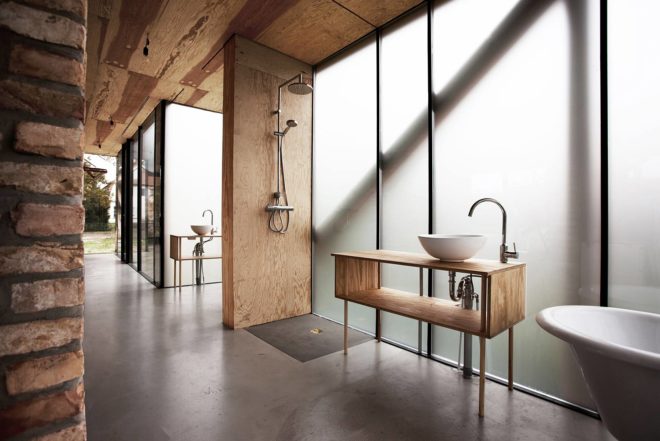 Peter Grundmann, prefab home, low cost home, House Neiling II, raised home, glass and wood minimal home, Berlin, single woman owner, DIY furniture, Löwenberger Land