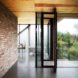 Peter Grundmann, prefab home, low cost home, House Neiling II, raised home, glass and wood minimal home, Berlin, single woman owner, DIY furniture, Löwenberger Land