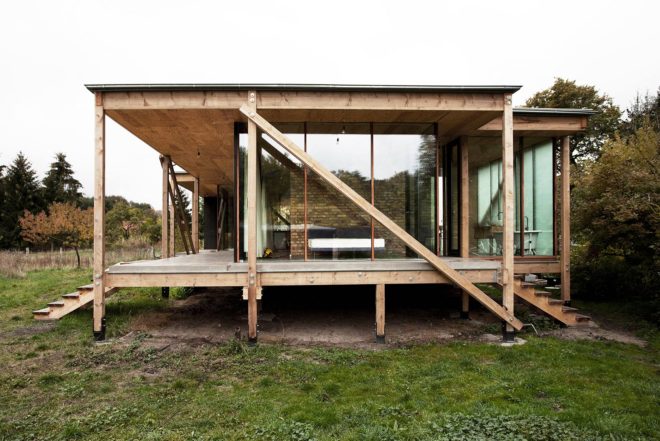 Peter Grundmann, prefab home, low cost home, House Neiling II, raised home, glass and wood minimal home, Berlin, single woman owner, DIY furniture, Löwenberger Land