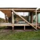 Peter Grundmann, prefab home, low cost home, House Neiling II, raised home, glass and wood minimal home, Berlin, single woman owner, DIY furniture, Löwenberger Land