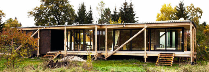 Peter Grundmann, prefab home, low cost home, House Neiling II, raised home, glass and wood minimal home, Berlin, single woman owner, DIY furniture, Löwenberger Land