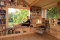garage converted to library, garage conversions, Tjøme garage library conversion by NOMA Architects, tree-house like library, floor to ceiling bookshelves