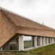Archispektras, Dune House, thatched roof, holiday house, Latvia, reed hatch, timber cladding, pine wood, green architecture, laminated timber, wood-burning stove