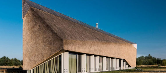 Archispektras, Dune House, thatched roof, holiday house, Latvia, reed hatch, timber cladding, pine wood, green architecture, laminated timber, wood-burning stove