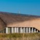 Archispektras, Dune House, thatched roof, holiday house, Latvia, reed hatch, timber cladding, pine wood, green architecture, laminated timber, wood-burning stove