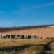 Archispektras, Dune House, thatched roof, holiday house, Latvia, reed hatch, timber cladding, pine wood, green architecture, laminated timber, wood-burning stove