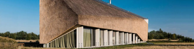 Archispektras, Dune House, thatched roof, holiday house, Latvia, reed hatch, timber cladding, pine wood, green architecture, laminated timber, wood-burning stove