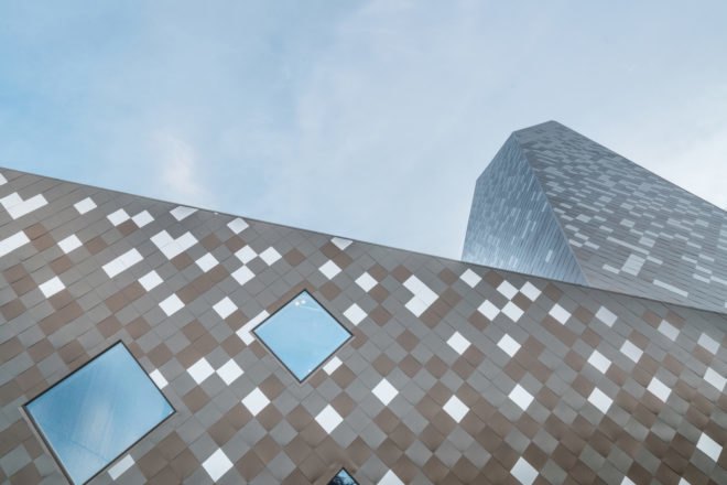 Norwegian Mountaineering Center by Reiulf Ramstad Arkitekter, Norwegian Mountaineering Center architecture, mountain inspired architecture, climbing wall in Norway, diamond shingle facade