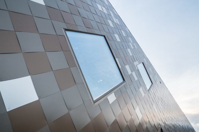 Norwegian Mountaineering Center by Reiulf Ramstad Arkitekter, Norwegian Mountaineering Center architecture, mountain inspired architecture, climbing wall in Norway, diamond shingle facade
