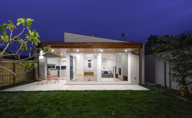 ITN Architects, Neumannhaus, green renovation, Victorian house, Melbourne, Australia, brick facade, green architecture, green fireplace, natural materials, cedar timber, verandah, open plan layout