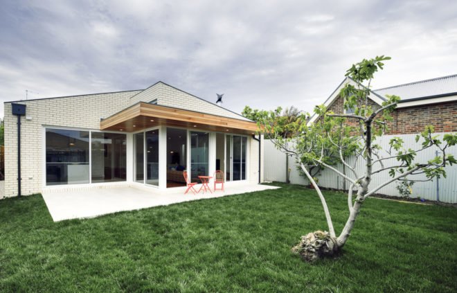 ITN Architects, Neumannhaus, green renovation, Victorian house, Melbourne, Australia, brick facade, green architecture, green fireplace, natural materials, cedar timber, verandah, open plan layout