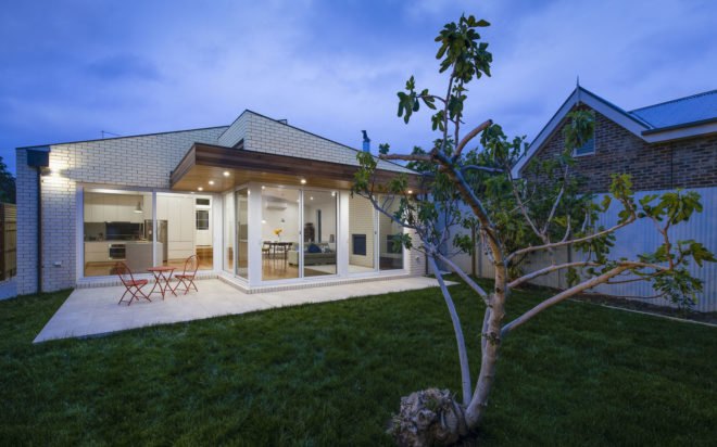 ITN Architects, Neumannhaus, green renovation, Victorian house, Melbourne, Australia, brick facade, green architecture, green fireplace, natural materials, cedar timber, verandah, open plan layout