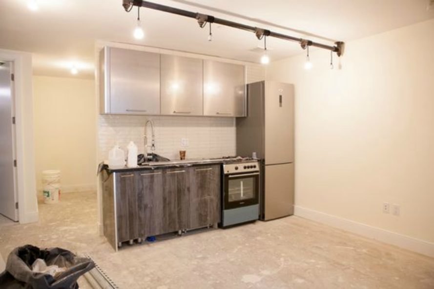 Subway station apartment, mta-themed building,All Year Management, brooklyn, bushwick mta themed house, Jake Berman, bushwick subway, brooklyn architecture, 132A Stanhope Street, STANHOPE STREET STATION, quirky home design, mta home brooklyn, subway home bushwick, urban art