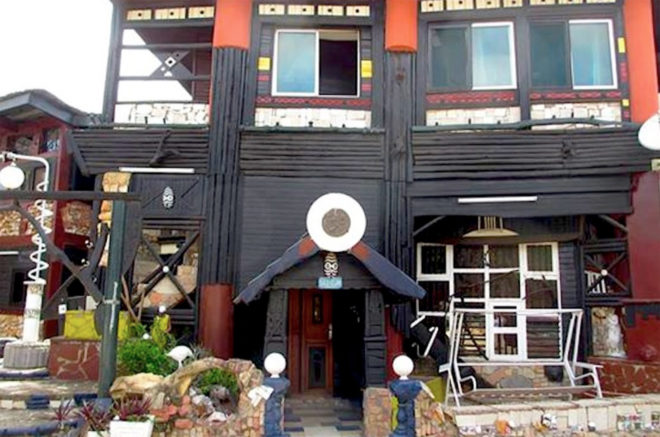 Wheel Story House, Ghana, Accra, Sammy Mensah Ansah, upcycle, reclaimed wood, recycled materials, reclaimed materials, house made from trash, trash construction materials, upcycled construction materials, west africa