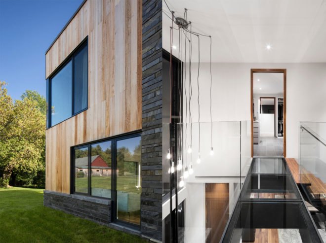 Hemmingford House by SIMARD Architecture, contemporary cottage near Montreal, fieldstone foundations, cedar and slate house, cedar and slate facade