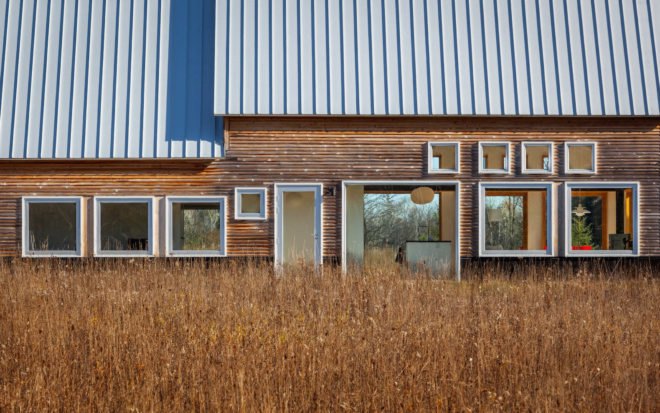 House for Beth by Salmela Architect, Door County contemporary house, house with IKEA furnishings, Wisconsin contemporary architecture, barn-inspired architecture, standing seam metal roof,
