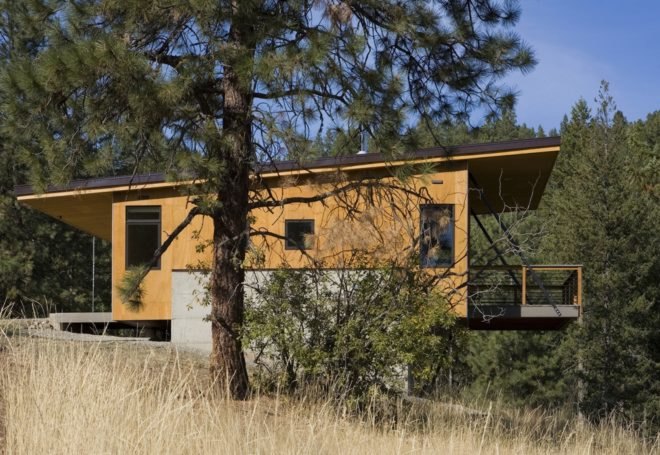 Pine Forest Cabin by Prentiss Balance Wickline Architects, cabin in Methow Valley, affordable modern cabin design, cabin design on a budget, cabin with a small footprint, cantilevered cabin design