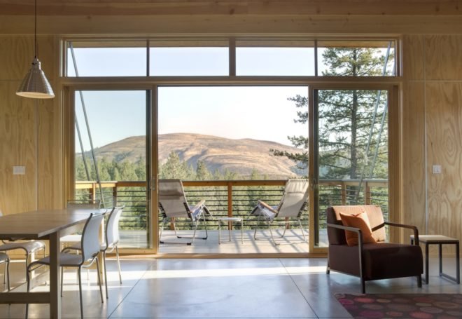 Pine Forest Cabin by Prentiss Balance Wickline Architects, cabin in Methow Valley, affordable modern cabin design, cabin design on a budget, cabin with a small footprint, cantilevered cabin design