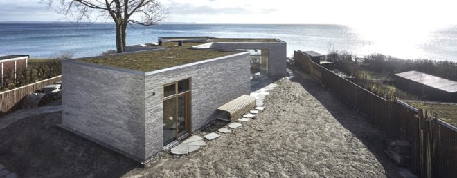 Villa Platan by ADEPT, Villa by the Sea by ADEPT, Kattegat sea architecture, Kolumba brick architecture, curved Kolumba brick, curved bricks, bespoke brick architecture, gray brick house, green-roofed Danish architecture