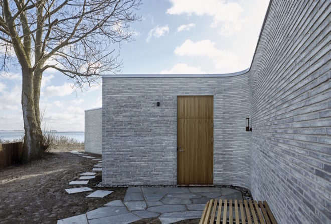 Villa Platan by ADEPT, Villa by the Sea by ADEPT, Kattegat sea architecture, Kolumba brick architecture, curved Kolumba brick, curved bricks, bespoke brick architecture, gray brick house, green-roofed Danish architecture