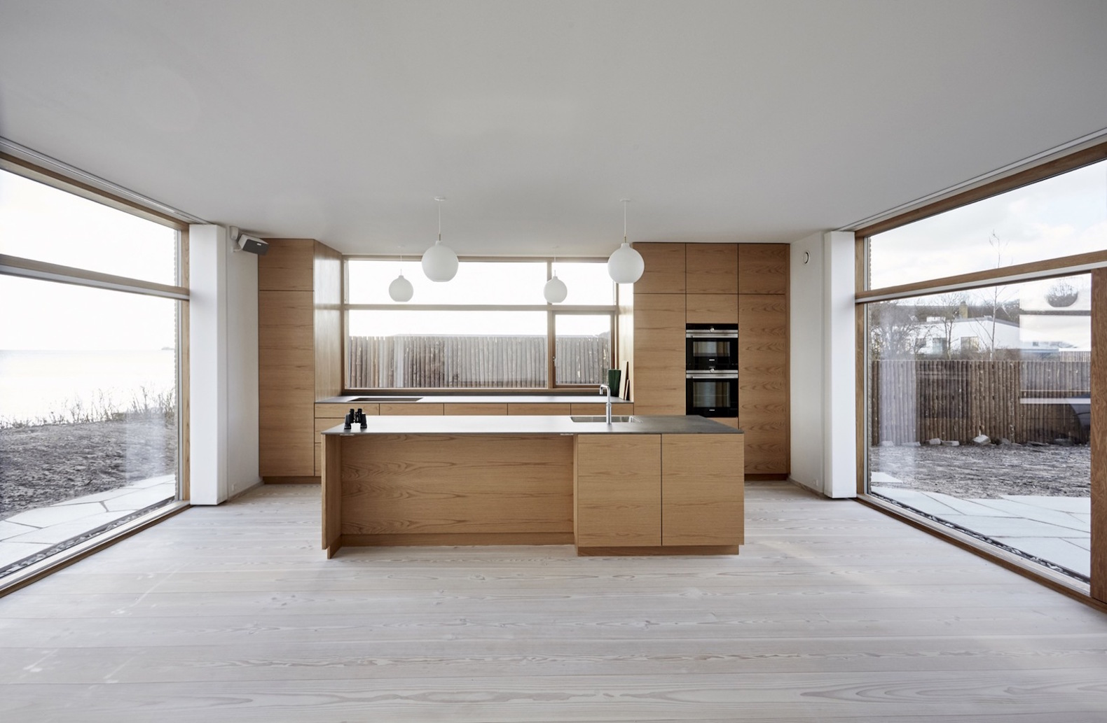 Villa Platan by ADEPT, Villa by the Sea by ADEPT, Kattegat sea architecture, Kolumba brick architecture, curved Kolumba brick, curved bricks, bespoke brick architecture, gray brick house, green-roofed Danish architecture