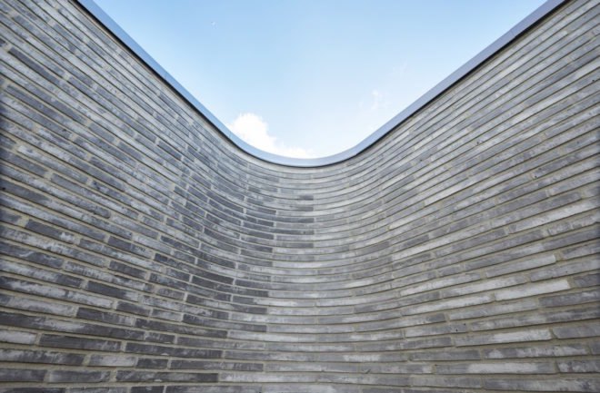 Villa Platan by ADEPT, Villa by the Sea by ADEPT, Kattegat sea architecture, Kolumba brick architecture, curved Kolumba brick, curved bricks, bespoke brick architecture, gray brick house, green-roofed Danish architecture