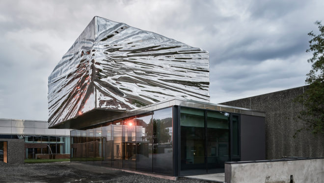 Snøhetta, Lillehammer Art Museum and Lillehammer Cinema, green extension, museum extension, stainless steel, Bård Breivik, green renovation, glass facade, transparent facade, auditorium