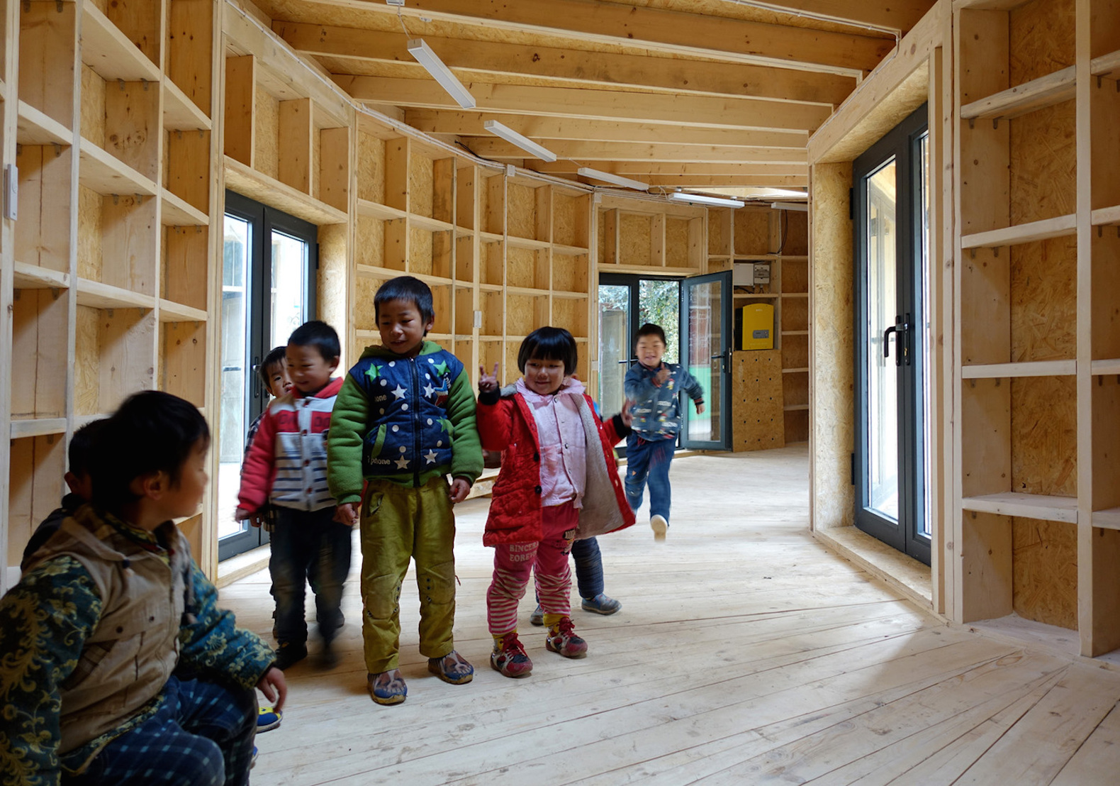 Tsiaogou reading room by SLOW Architects, SLOW Architects reading room, Tsiaogou library, library architecture for children, wooden reading room, fan-shaped architecture made from wood, low-tech Chinese timber architecture