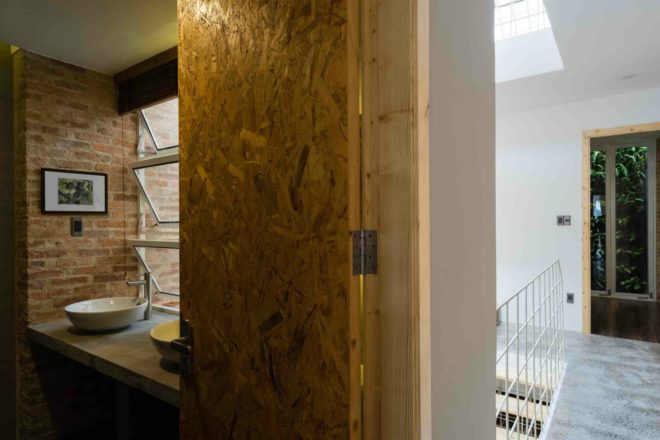 Block Architects, lee and tee house, home renovation, HoChiMinh City homes, HoChiMinh City architecture, white frames, brick walls, natural light, home renovation vietnam, urban design, steel building material, green design, green home renovation, vertical garden