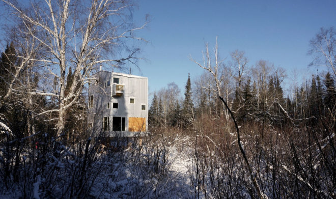 Pole House, DIN Projects, house on stilts, Canada, cottage, stilts, recycled pipes, green architecture, Lake Winnipeg, wood-burning stove