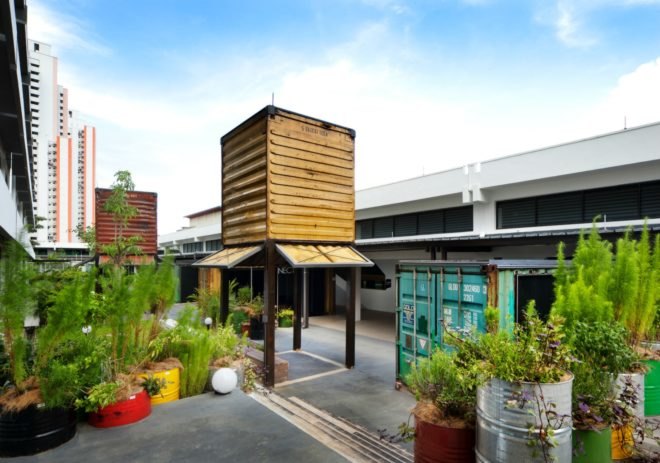 WOHA Architects, Enabling Village, Bukit Merah Vocational Institute, universal design, upcycled materials, timber building materials, singapore architecture, recycled oil drum planters, recycled building materials, green building, water gardens, landscape architecture, landscape design, all-inclusive design,