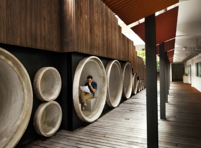 WOHA Architects, Enabling Village, Bukit Merah Vocational Institute, universal design, upcycled materials, timber building materials, singapore architecture, recycled oil drum planters, recycled building materials, green building, water gardens, landscape architecture, landscape design, all-inclusive design,