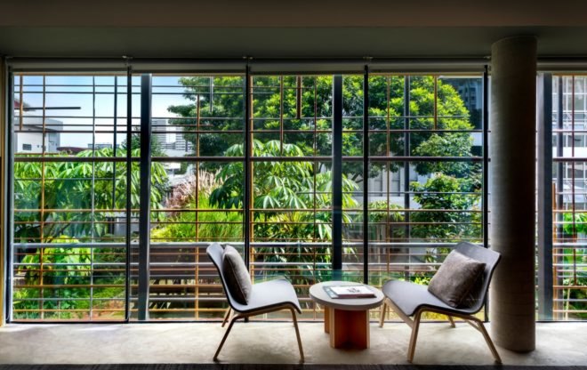 WOHA Architects, Enabling Village, Bukit Merah Vocational Institute, universal design, upcycled materials, timber building materials, singapore architecture, recycled oil drum planters, recycled building materials, green building, water gardens, landscape architecture, landscape design, all-inclusive design,