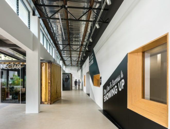 WOHA Architects, Enabling Village, Bukit Merah Vocational Institute, universal design, upcycled materials, timber building materials, singapore architecture, recycled oil drum planters, recycled building materials, green building, water gardens, landscape architecture, landscape design, all-inclusive design,