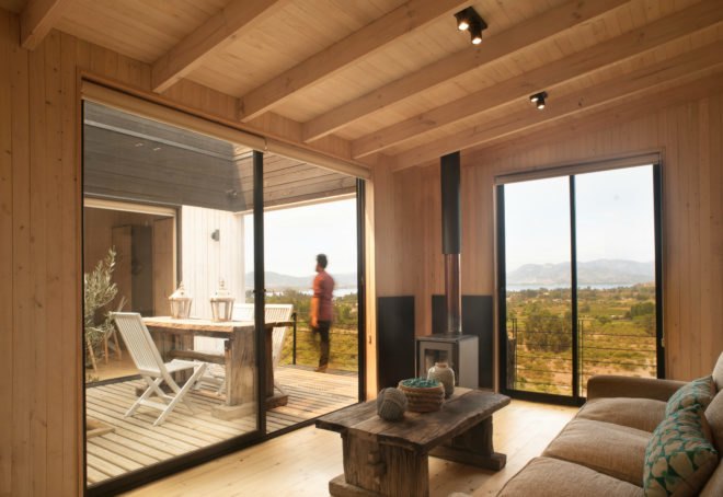 B+V Architects, Folding House, Folding House Chile, climate-controlled homes, responsive design, home design, passive cooling techniques, passive cooling technology, passive cooling, passive homes, energy efficient home design, green design, sustainable design, efficient design, home design, architecture, wooden shade, wooden facade,