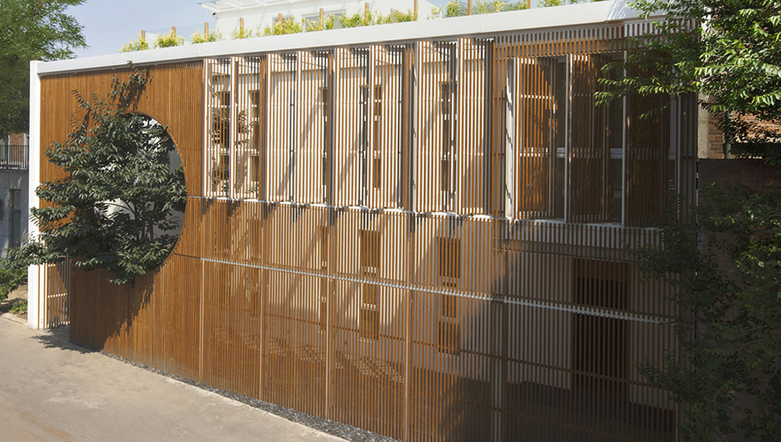 Elongated Industrial Box, Ding Hui Yuan Zen & Tea Chamber, He Wei Studio / 3andwich Design, green renovation, factory renovation, Beijing, Chinese garden, inner courtyard, meditation room, green architecture, office space, ramps and walkways