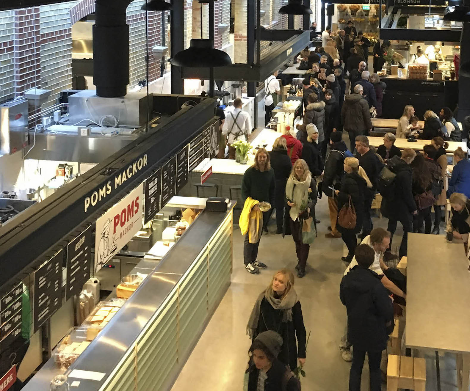 warehouse renovated into food hall, market hall adaptive reuse, Malmö Market Hall, Malmo Market Hall by Wingardh, Nina Totté Karyd and Martin Karyd, Corten steel clad market hall, corten steel in adaptive reuse,