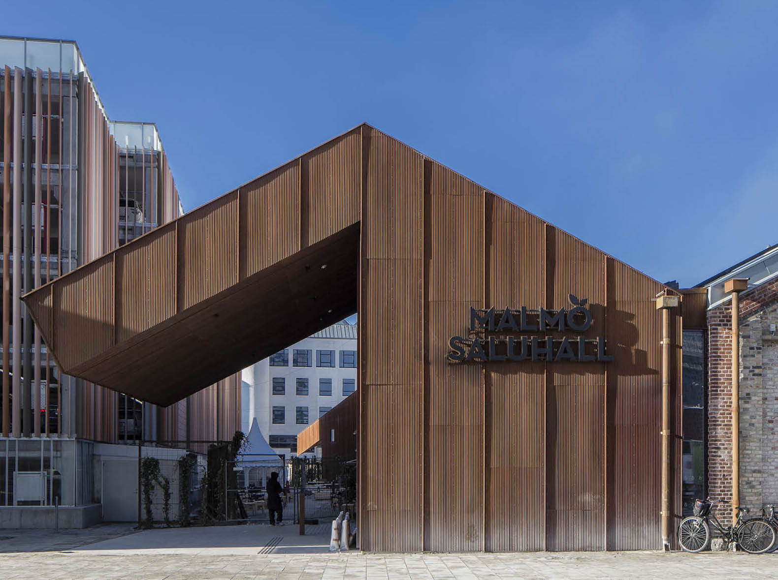 warehouse renovated into food hall, market hall adaptive reuse, Malmö Market Hall, Malmo Market Hall by Wingardh, Nina Totté Karyd and Martin Karyd, Corten steel clad market hall, corten steel in adaptive reuse,