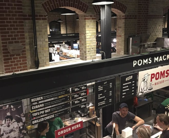 warehouse renovated into food hall, market hall adaptive reuse, Malmö Market Hall, Malmo Market Hall by Wingardh, Nina Totté Karyd and Martin Karyd, Corten steel clad market hall, corten steel in adaptive reuse,