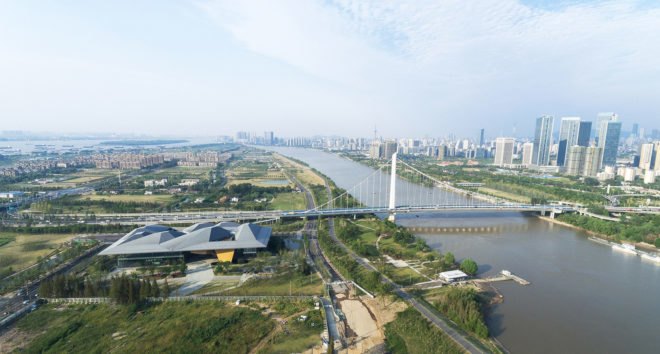 Nanjing Eco-Tech Island Exhibition Center, Nanjing Eco-Tech Park, NBBJ, oculus, tech incubator, light cannons, LEED certification, China, Nanjing, green campus, green exhibition space, courtyard, daylighting, solar shading, overhang