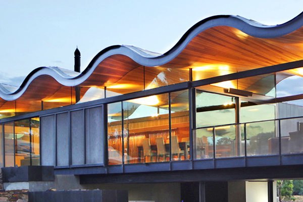Lauriston house by Seeley Architects, contemporary Australian rural architecture, Kyneton architecture, passive solar homes in Australia, wavy roof, sinuous roof, Messmate timber lining, French pattern bluestone, cantilevered home