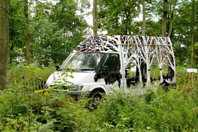 Dan Rawlings, Nature Delivers, art, van art, nature-inspired art, forest art, street sign art, urban art, vehicle art, Lost Eden festival, metal sculpture, art sculpture, metal cutting art, repurposed vans, urban artists, graffiti art,