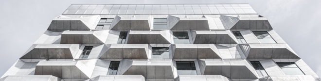 the Silo by COBE, The Silo Nordhavn, The Silo apartments, repurposed silo architecture, galvanized steel facade, adaptive reuse apartments, Nordhavn apartments, adaptive reuse silo